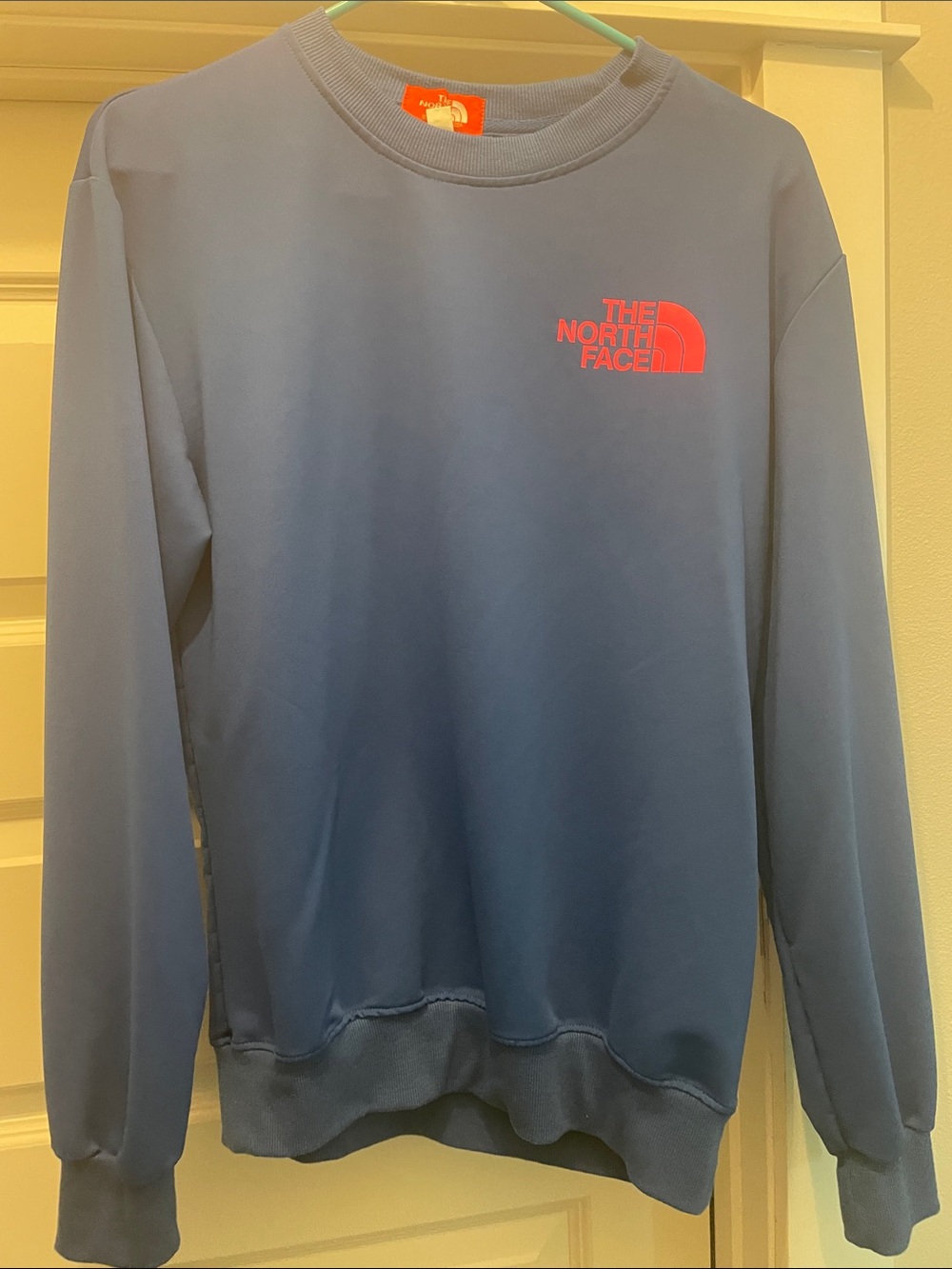 The North Face Women’s Blue Crewneck with Pink Logo
